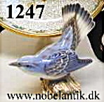 Blue warbler. H. 11 cm.  kr 1200.-